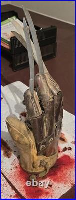A Nightmare on Elm Street Metal Glove with stand