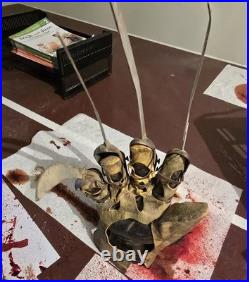 A Nightmare on Elm Street Metal Glove with stand