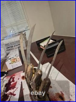 A Nightmare on Elm Street Metal Glove with stand