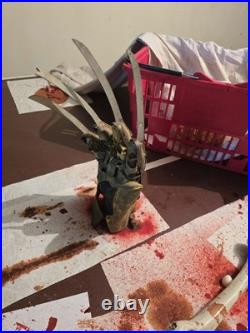 A Nightmare on Elm Street Metal Glove with stand